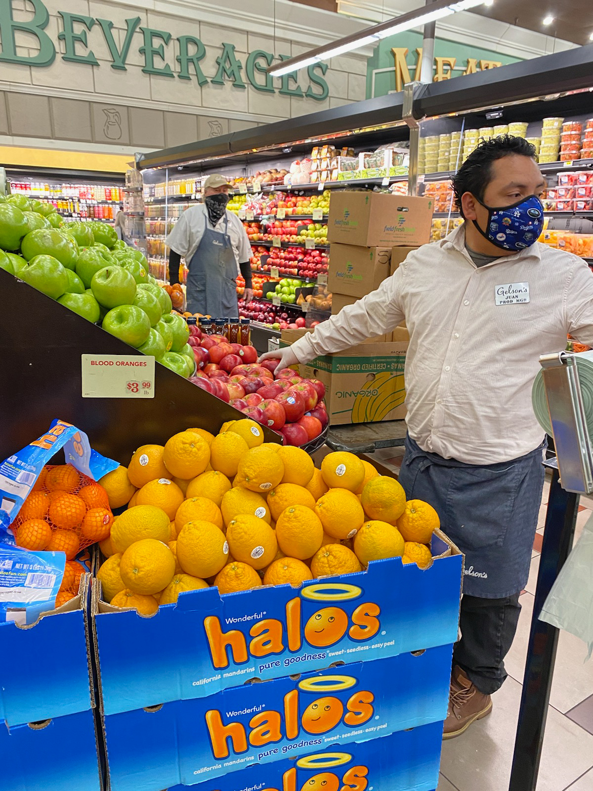 Juan Vasquez arranging apples in the Gelson’s West Hollywood store. 