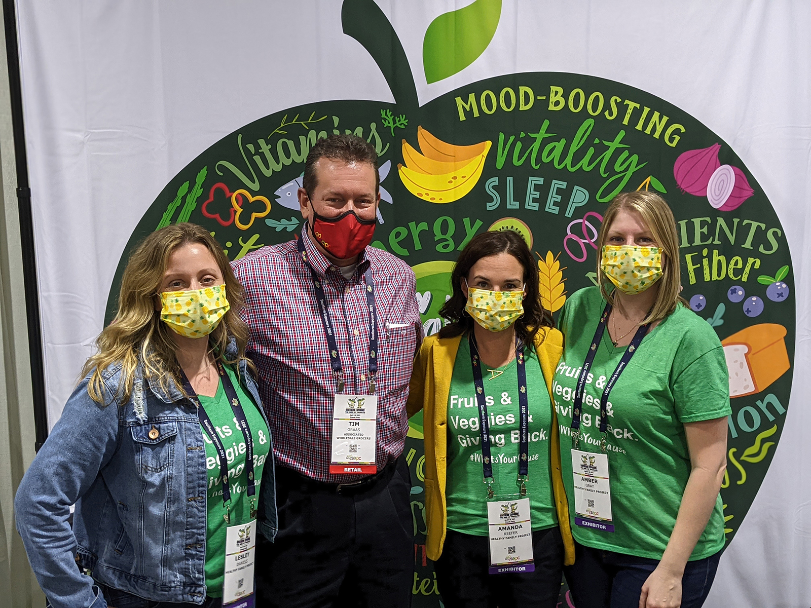 Tim Graas of Associated Wholesale Grocers flanked by Lesley Daniels, Amanda Keefer and Amber Gray of Healthy Family Project.