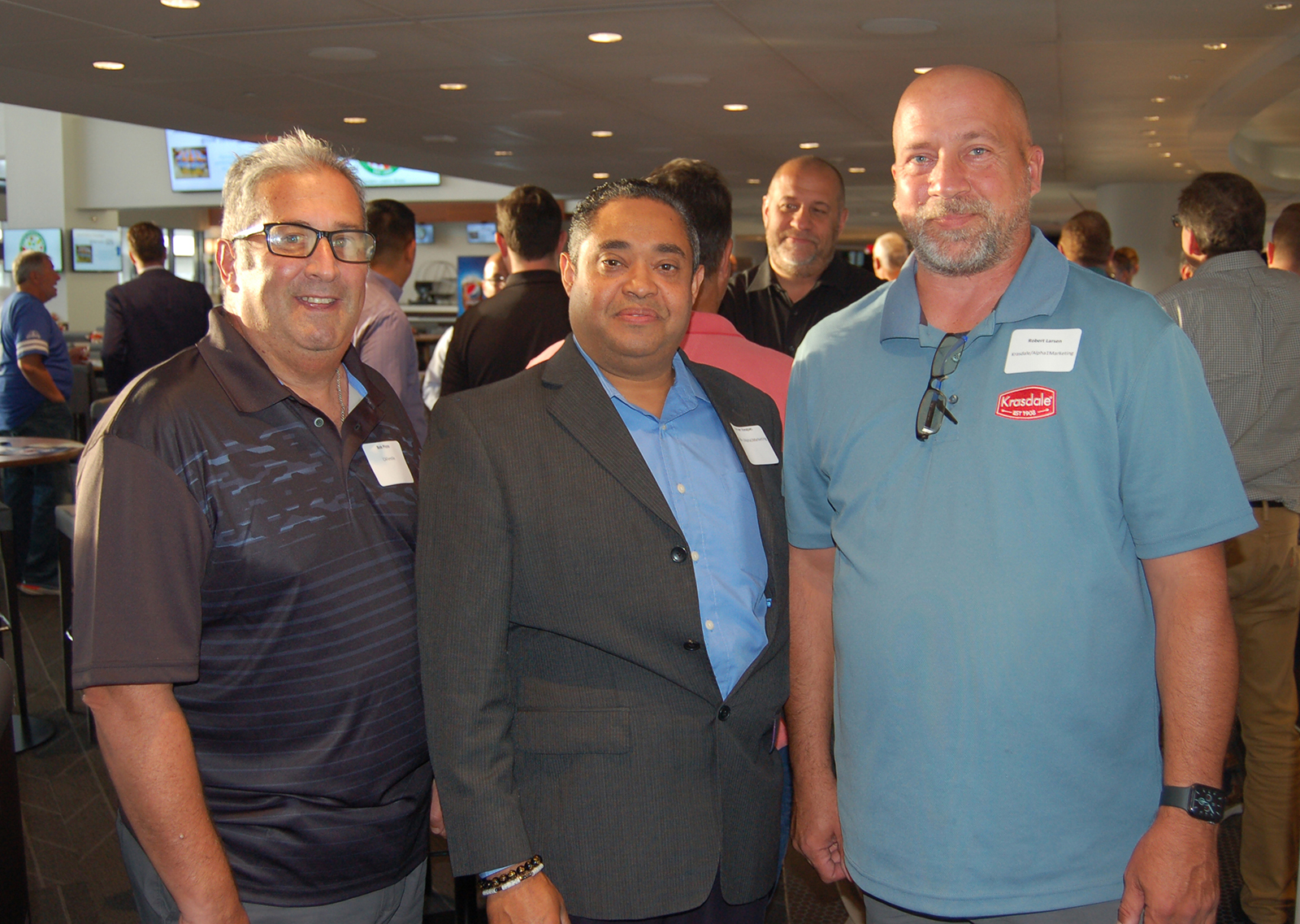 Bob Pizzo of CAFerolie with Juan Vasquez and Robert Larsen of Krasdale/Alpha 1 Marketing.
