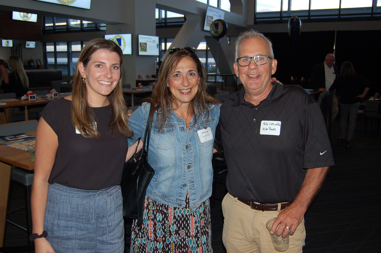 Catherine Delettera and Debbie Rogers of Zespri with Bob Catinella of USA Pears. 
