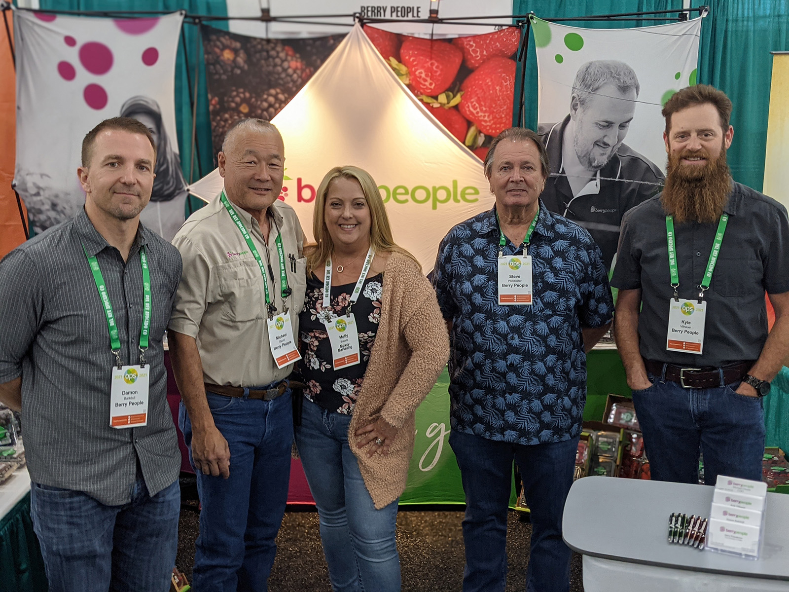 Molly Briseno of Moxxy Marketing surrounded by Damon Barkdull, Michael Osumi, Steve Poindexter and Kyle Vilhauer of Berry People.