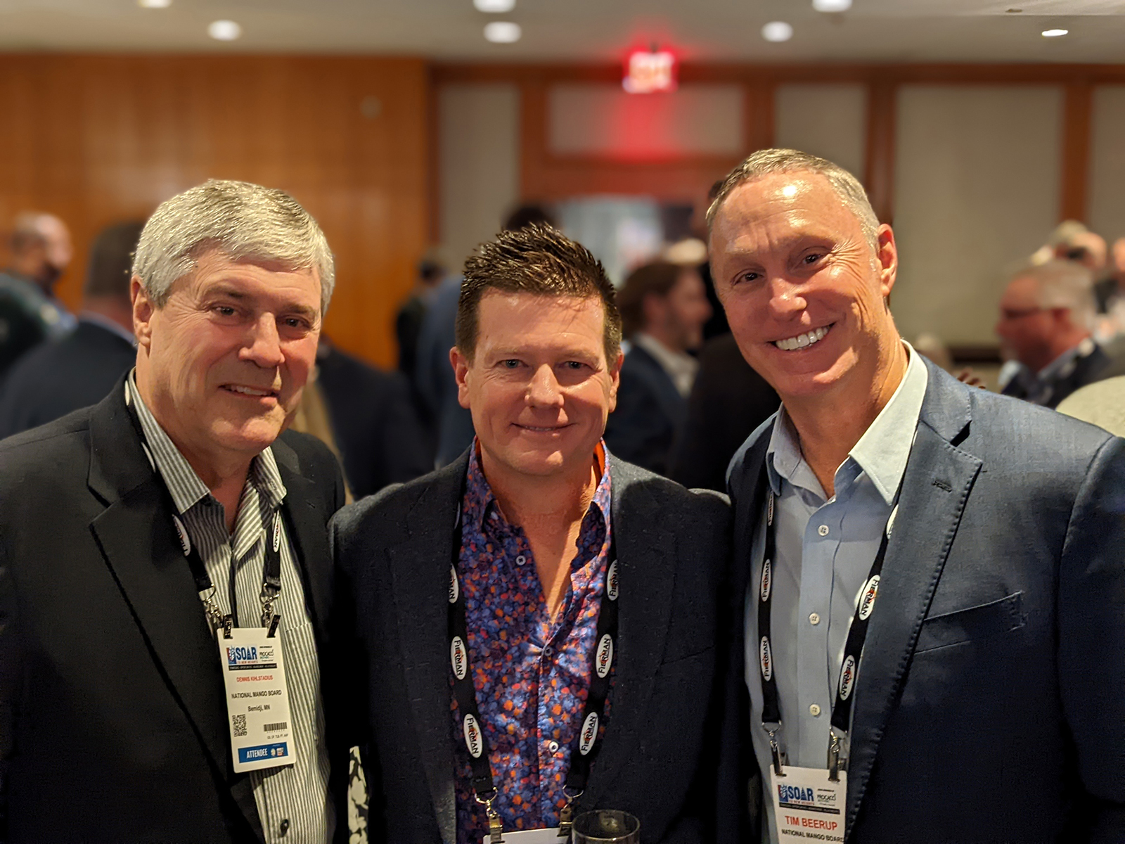 Anthony Mitchell of Associated Wholesale Grocers flanked by Dennis Kihlstadius and Tim Beerup of the National Mango Board.