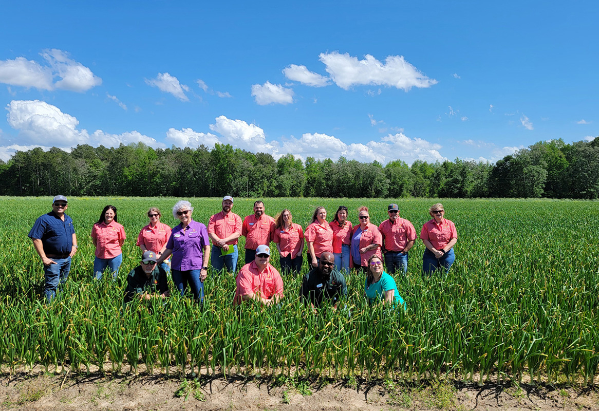 The group in one of Bland Farms' onion fields.