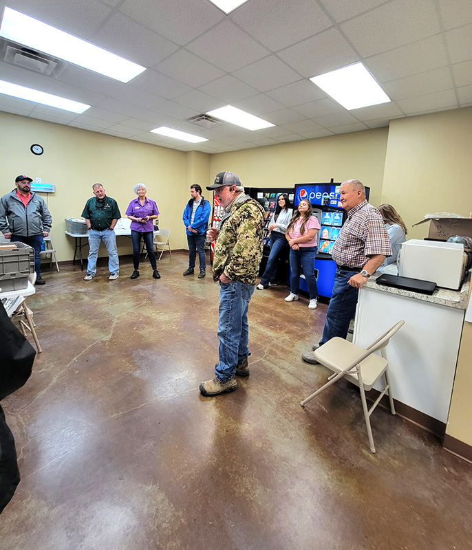 Bo Herndon (center), owner of Superfit Greens, told the class how his company was founded.