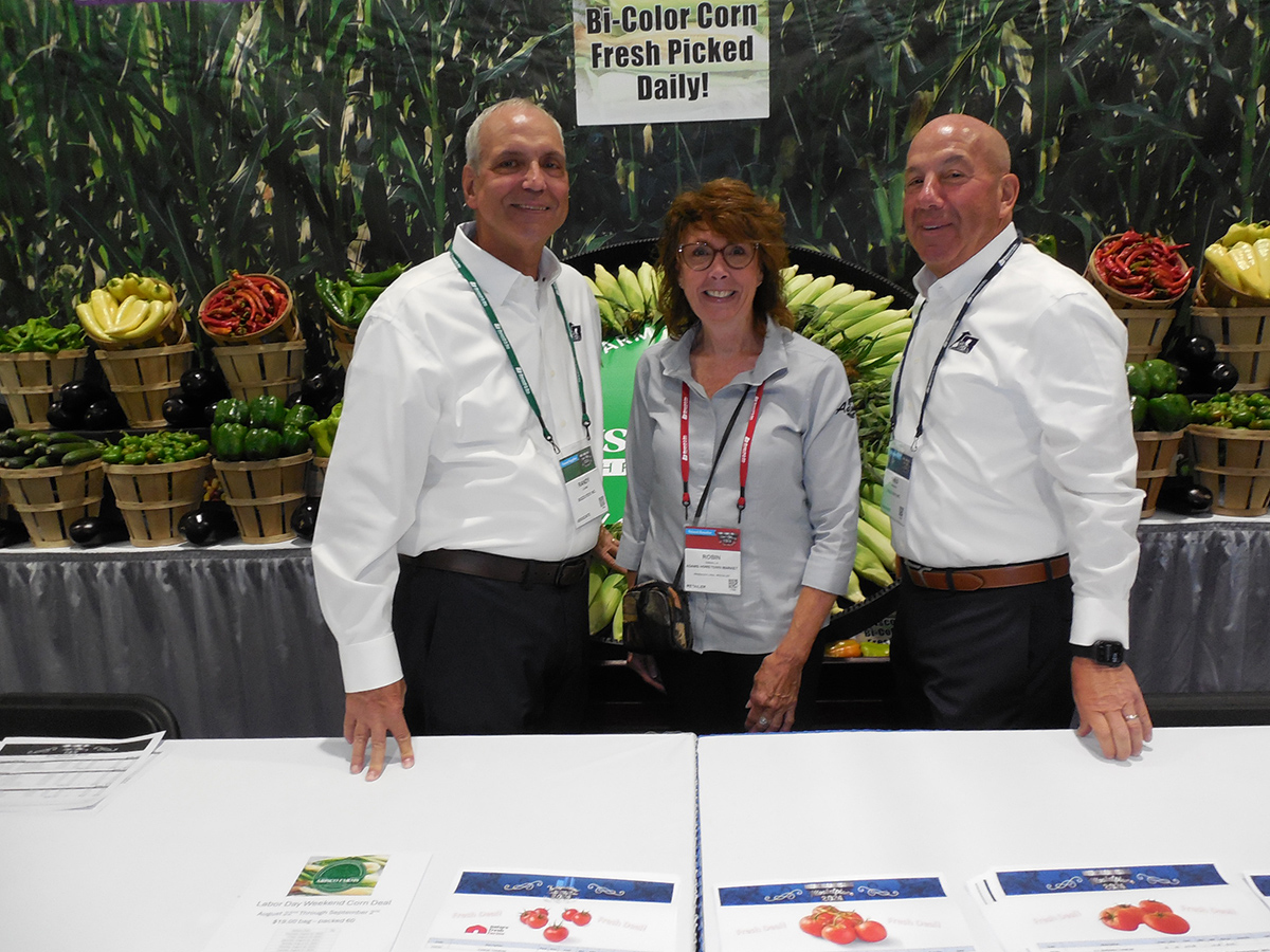 Robin Cassella (center) of Adams Hometown Market flanked by Randy Levine and Greg Veneziano of Bozzuto’s Inc.
