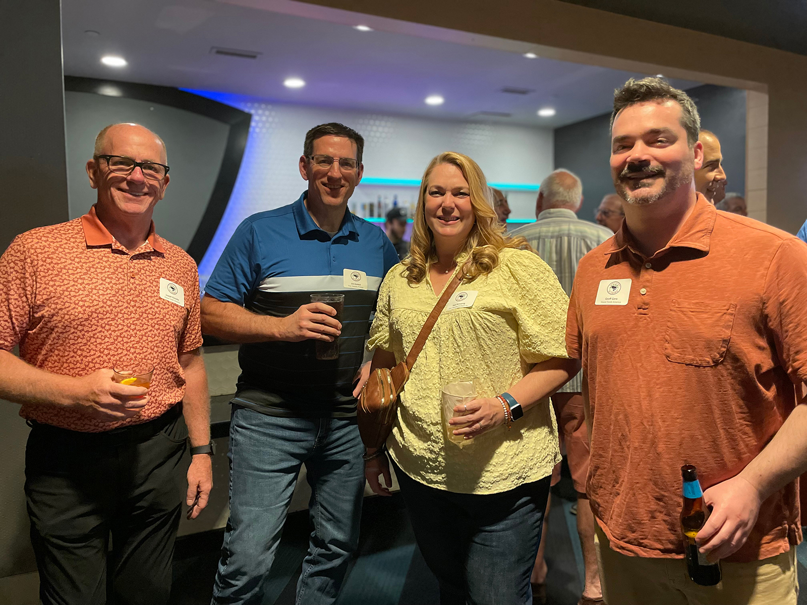 Jim Koelsch and Traci Sensenig of Four Seasons Produce flanked by Joseph Kaszuba and Geoff Gero of House Foods America.