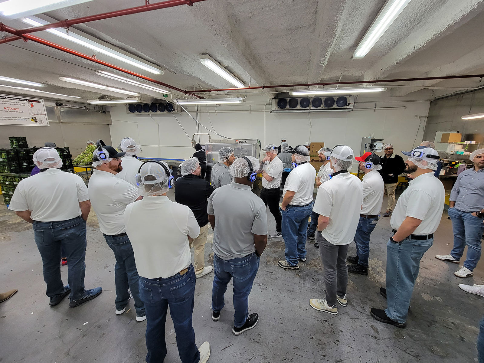 Jorge Bastitas brings the group around the packing facility.