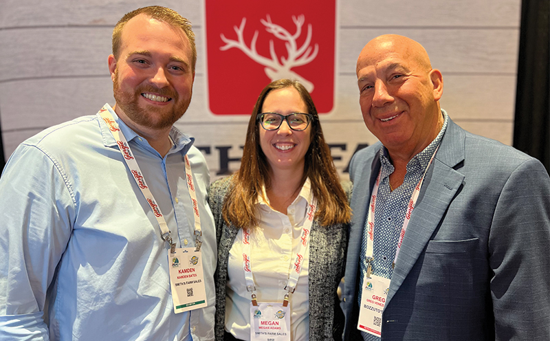 Greg Veneziano (right) of Bozzuto’s stopped at the Smith’s Farm booth to visit with Kamden Bates and Megan Adams.