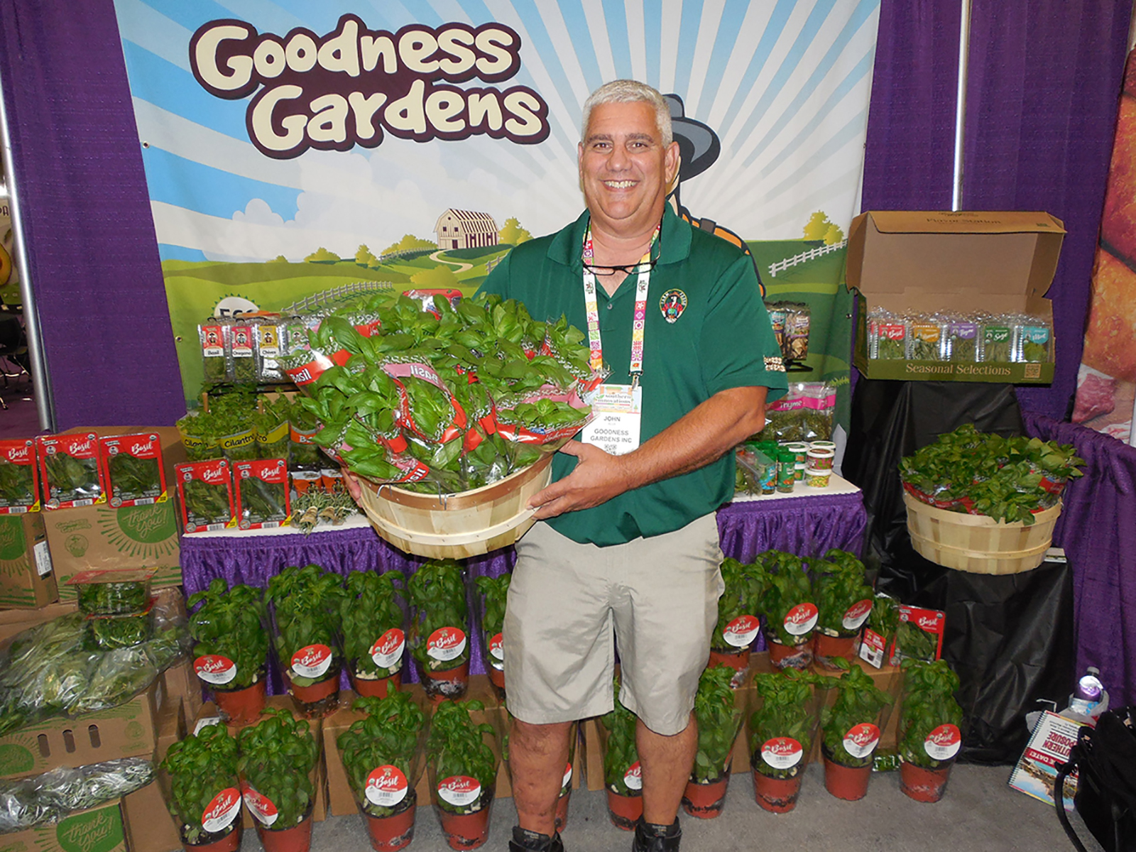 John Alva of Goodness Gardens with fresh basil.