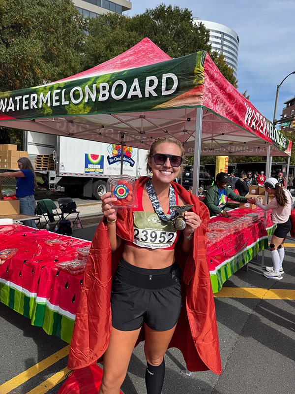 A marathon finisher with watermelon.