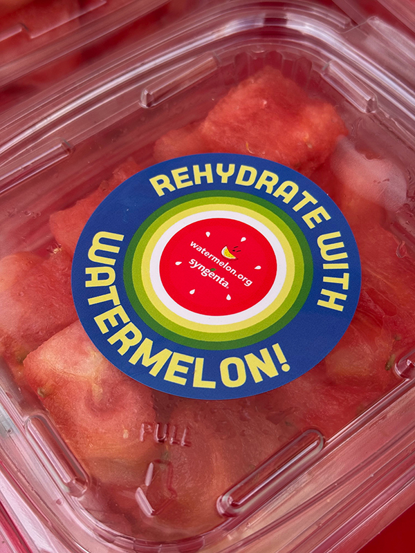 Fresh watermelon with a sticker.