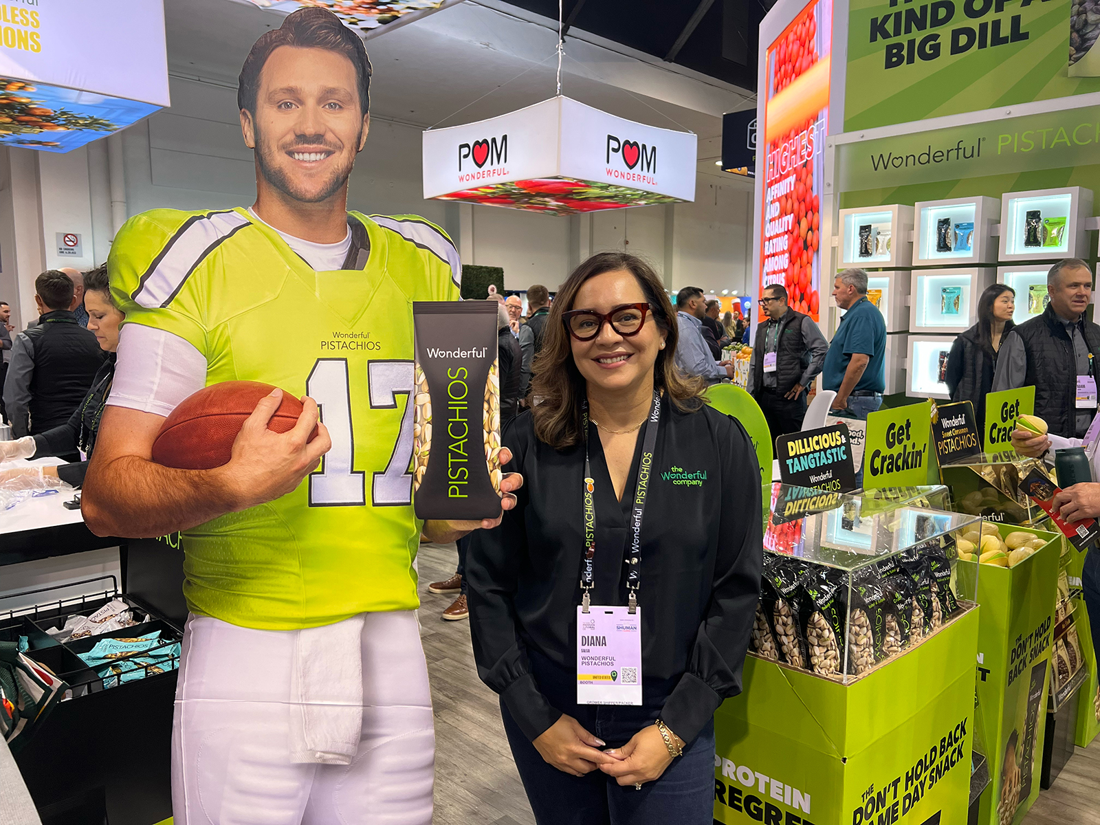 Diana Salsa of The Wonderful Company with the life-size cutout of NFL Quarterback Josh Allen, who is the celebrity spokesperson for Wonderful Pistachios. 