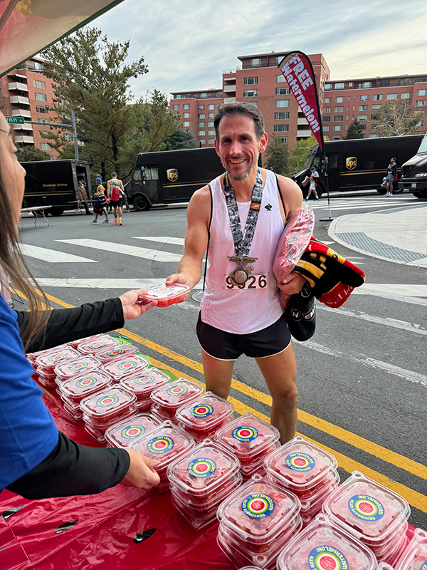 A marathon finisher with watermelon.