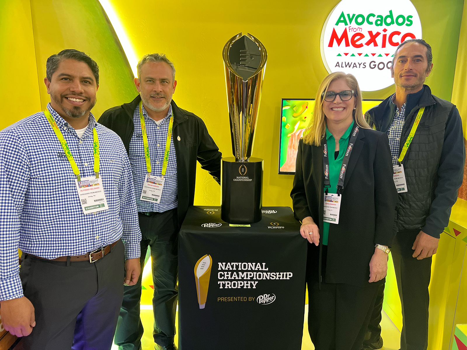 Alfonso Delgado, Oscar Garcia, Tania Edwards and Ryan Fukuda proudly displayed the College Football Playoff National Championship Trophy at the Avocados from Mexico booth.
