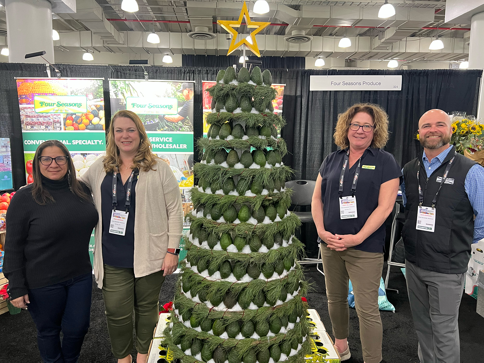 Four Seasons Greetings! The Ephrata, PA-based distributor featured a Christmas tree made from Hass avocados to help usher in the holiday season. Shown are Rosita Rosario, Traci Sensenig, Ginny Williams and Wayne Hendrickson.