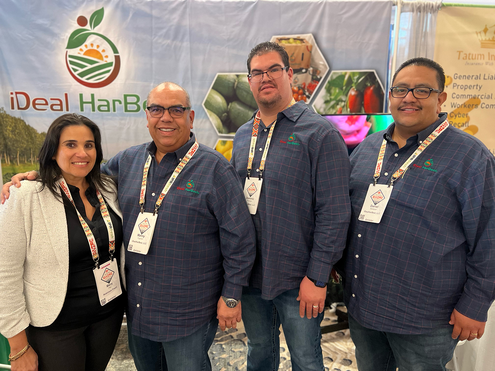 Mary Paz of Robinson Fresh stopped at the iDeal HarBest booth to visit with Manny Fajardo, Dominic Romero and Danny Baltazar.