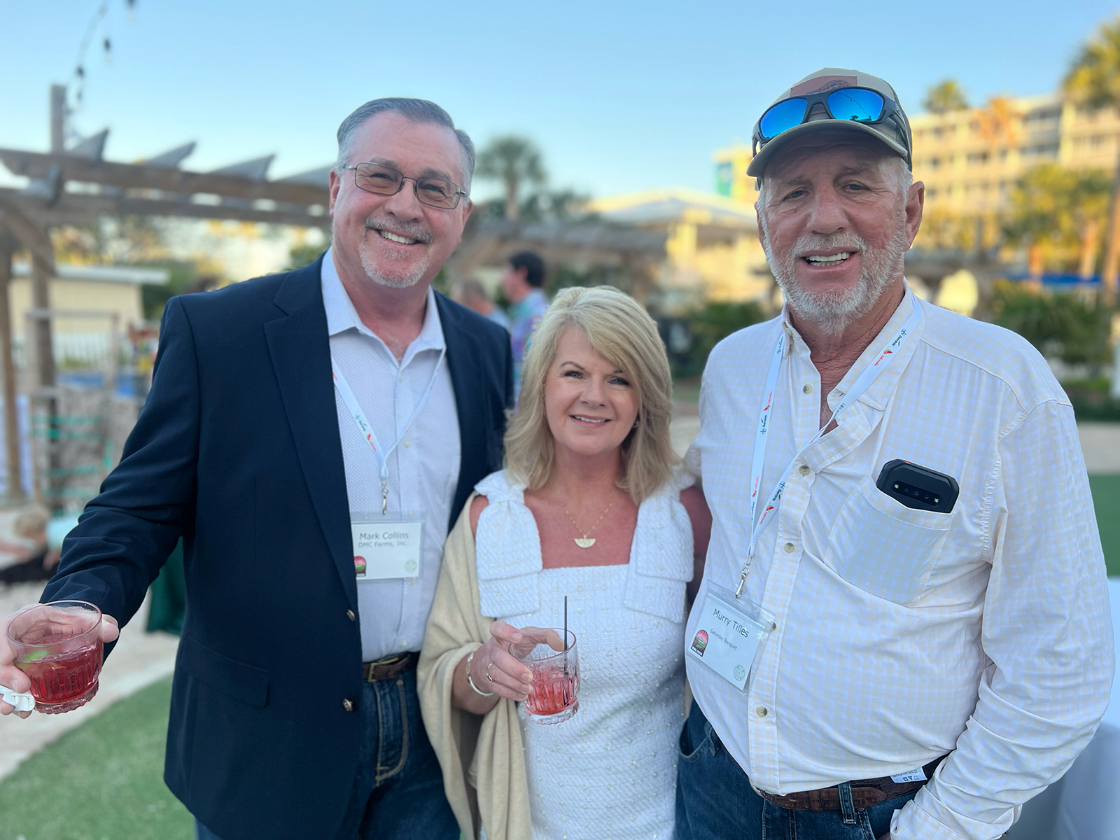 Mark and Dawn Collins of DMC Farms with Murray Tillis of Tillis Farms.