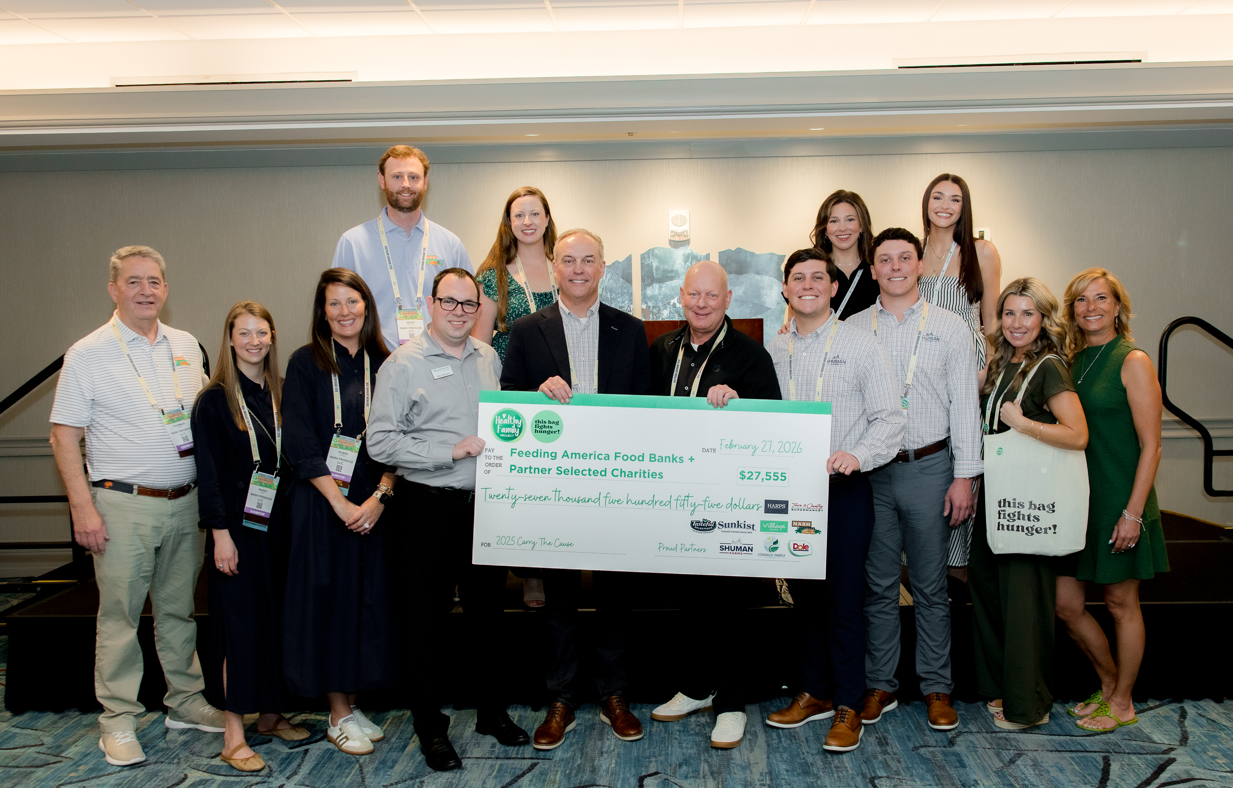 Carry the Cause Campaign check presentation, benefitting Feeding America & Partner Selected Charities.