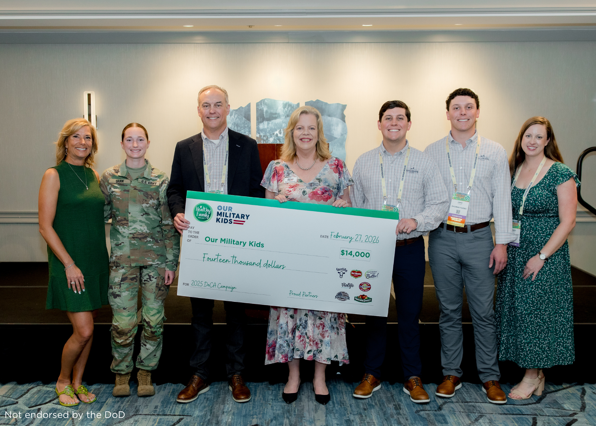 DeCA campaign check presentation, benefitting Our Military Kids. 