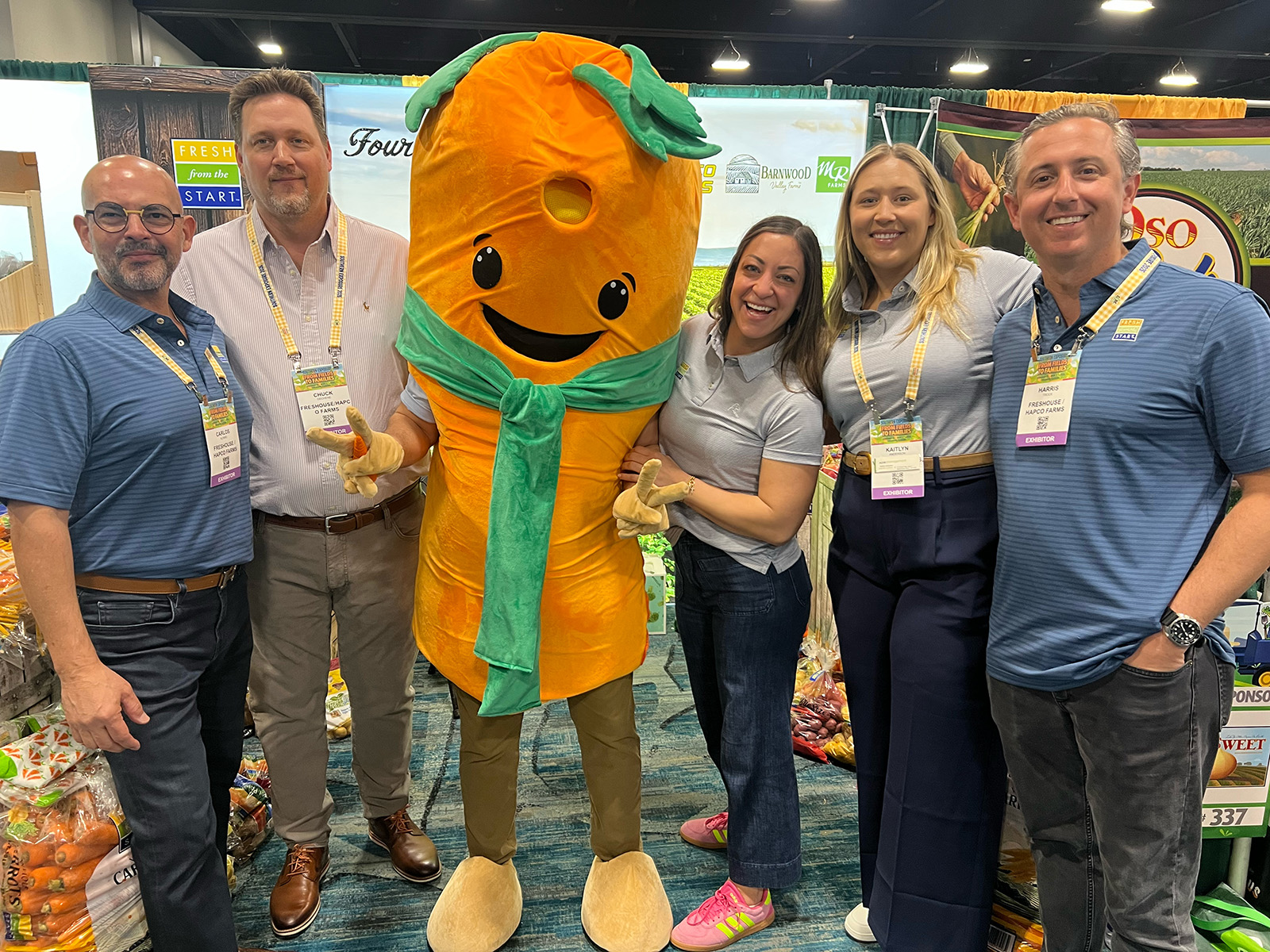With their carrot mascot at the Freshouse/Hapco Farms booth were Carlos Alvaro, Chuck Dechene, Kimberly Bourbeau, Kaitlyn Anderson and Harris Trock.