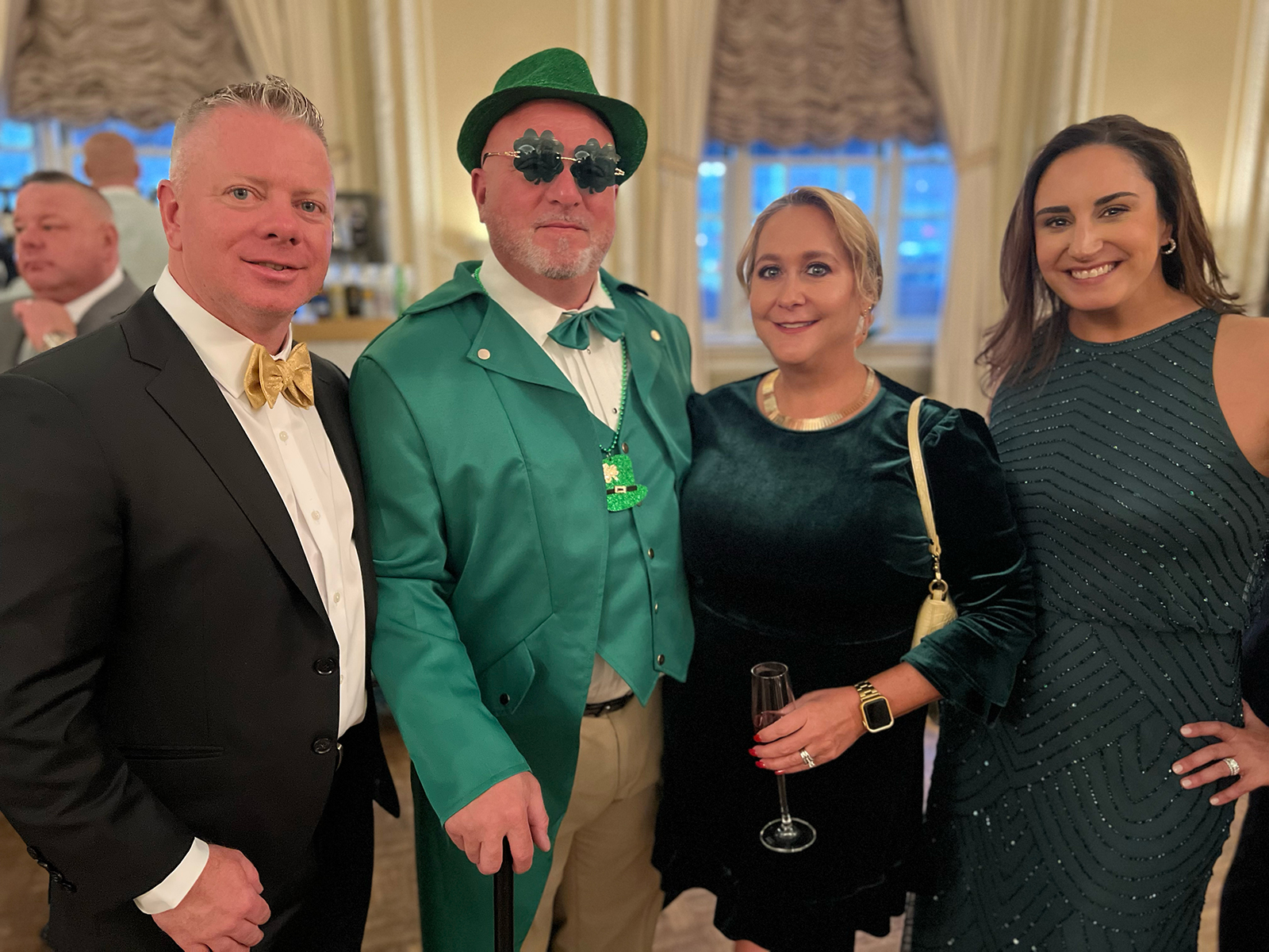 Anthony Sattler (left) of C&S Wholesale and Raquel Mello (right) of Hapco Farms with their festive guests Brad and Karen Bacon.