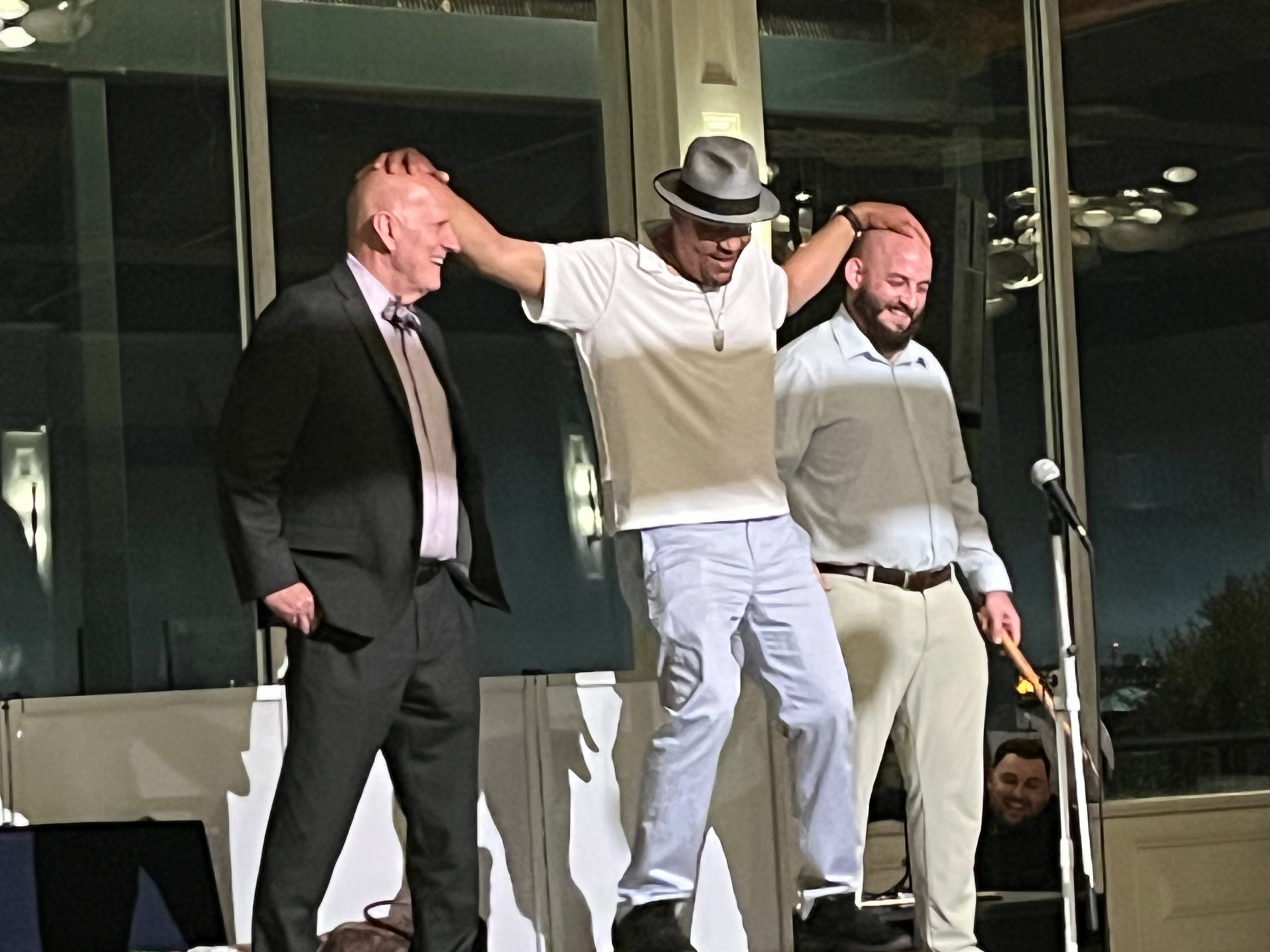 Comedic Magician Kevin Lee performing with audience members.