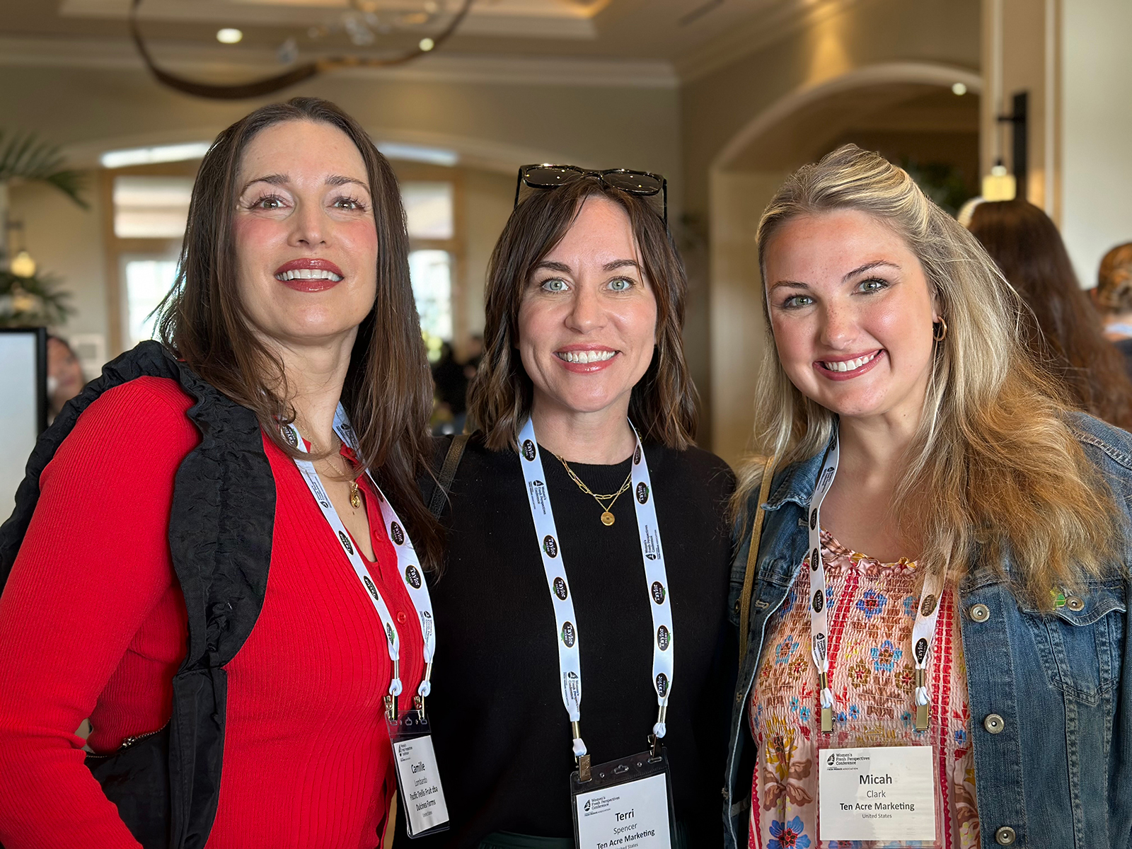 Camille Lombardo of Pacific Trellis Fruit with Teri Spencer and Micah Clark of Ten Acre Marketing.