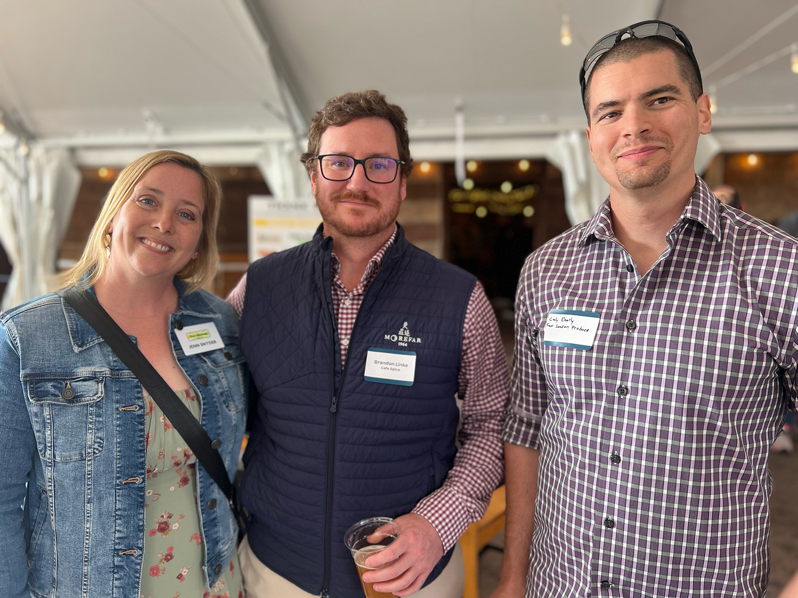 Brandon Linke (center) of Cafe Spice with Jenn Snyder and Cody Eberly of Four Seasons.