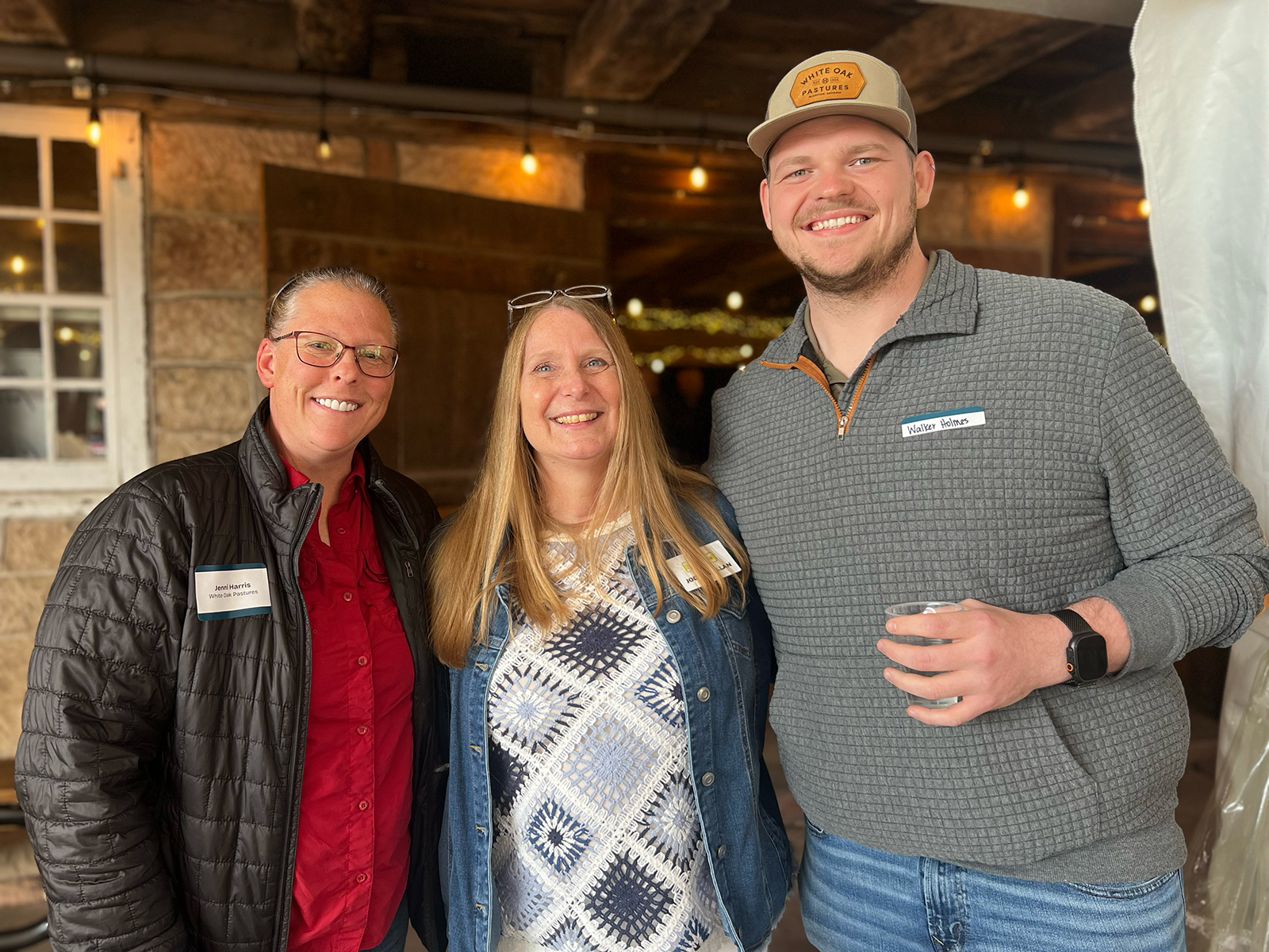 Jody McGillan (center) of Four Seasons with Jenni Harris and Walker Holmes of White Oak Pastures.