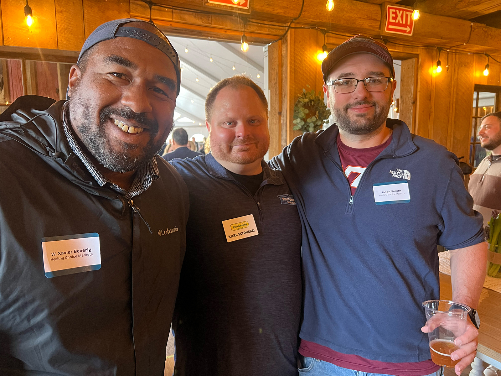 Karl Schwebel (center) of Four Seasons with Xavier Beverly and Jason Smyth of Healthy Choice Markets.