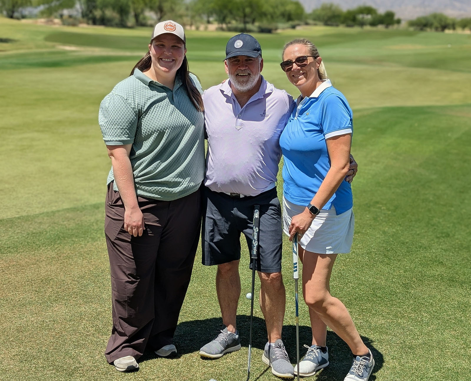 MIke Downey (center) of Millitary Produce Group flanked by Miranda Elam and Christina Hahn of Lipman Family Farms.