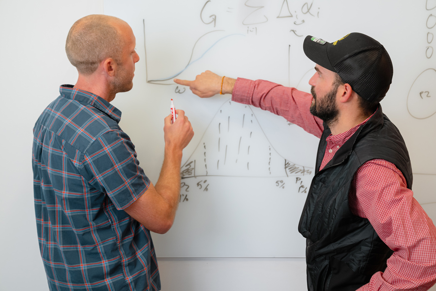 Tim Beissinger (Heritable CTO) and Joel Smith (Sr. Computational Biologist) discuss the latest in AI implementation for breeding. (Photo by Yunus Emre Cakir)