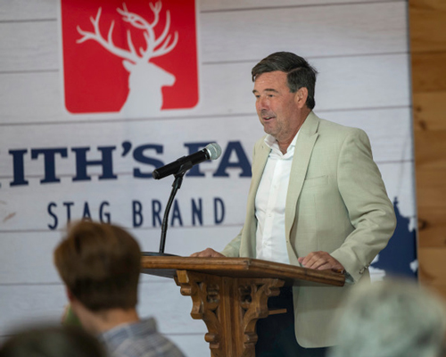 Christopher Buchanan, Director of Public Affairs, State and Local Government Relations for Walmart, addressed attendees of the Sept. 24 local produce celebration at Smithâs Farmsâ facility in Westfield, ME