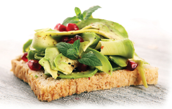 bigstock-Sliced-Avocado-And-Ripe-Pomegr-266046802